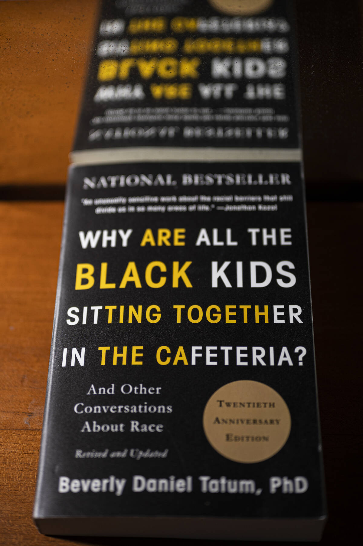 A copy of the book “Why Are All the Black Kids Sitting Together in the Cafeteria” by Sharon Creech.